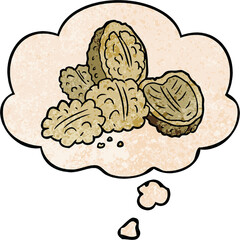 cartoon walnuts with thought bubble in grunge texture style