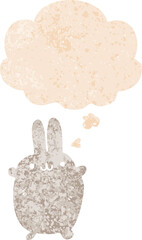 cartoon rabbit with thought bubble in grunge distressed retro textured style