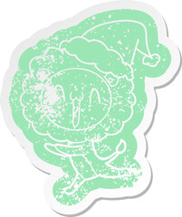 happy quirky cartoon distressed sticker of a lion wearing santa hat