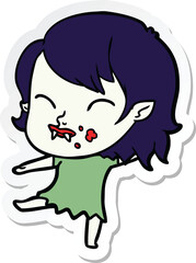 sticker of a cartoon vampire girl with blood on cheek