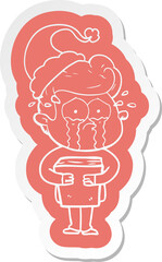 quirky cartoon  sticker of a crying man holding book wearing santa hat