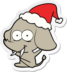 happy hand drawn sticker cartoon of a elephant wearing santa hat