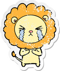 distressed sticker of a cartoon crying lion