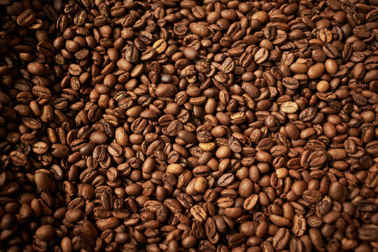 Top view background image of fresh roasted coffee beans, copy space