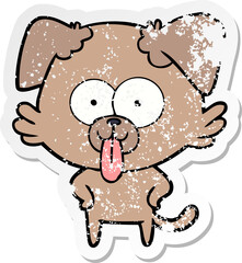 distressed sticker of a cartoon dog with tongue sticking out