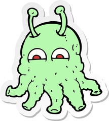sticker of a cartoon space alien