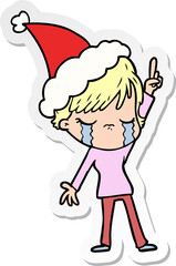 hand drawn sticker cartoon of a woman crying wearing santa hat