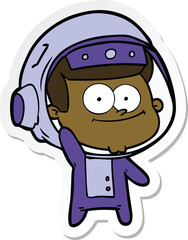 Obraz premium sticker of a happy astronaut cartoon