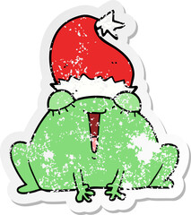 distressed sticker of a cute cartoon christmas frog