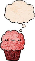 cartoon muffin with thought bubble in grunge texture style
