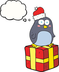 freehand drawn thought bubble cartoon christmas penguin