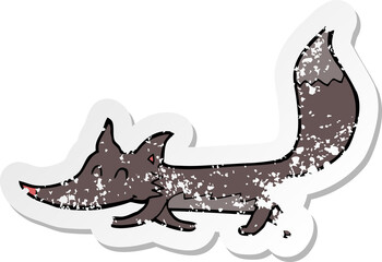 retro distressed sticker of a cartoon little wolf