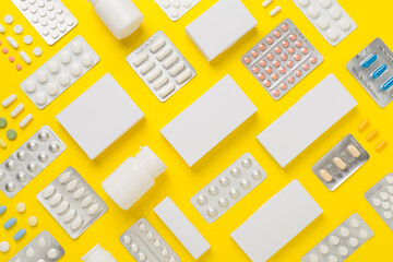 Flat lay with different pills in blister packaging and boxes and on color background
