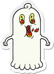 sticker of a cartoon ghost with flaming eyes