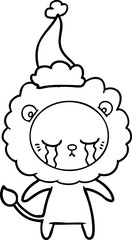 Obraz premium crying hand drawn line drawing of a lion wearing santa hat