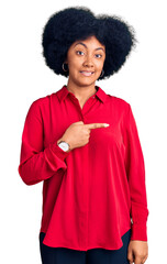 Young african american girl wearing casual clothes pointing aside worried and nervous with forefinger, concerned and surprised expression