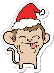 funny hand drawn sticker cartoon of a monkey wearing santa hat