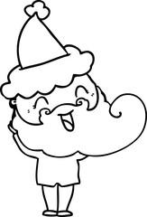 happy bearded man wearing santa hat