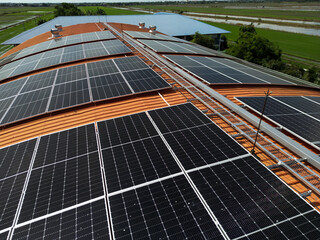 Top aerial view of solar roof system at the rooftop of factory warehouse. renewable energy of...