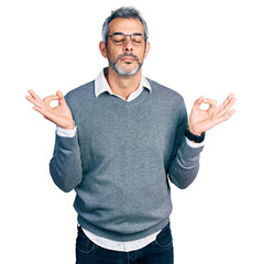Middle age hispanic with grey hair wearing glasses relaxed and smiling with eyes closed doing meditation gesture with fingers. yoga concept.
