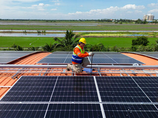 engineer man inspects construction of solar cell panel or photovoltaic cell at roof top. Industrial...