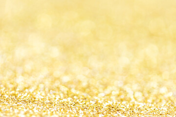 Golden lights Abstract  Christmas background. Magic shining gold dust. Holiday New year Glitter...