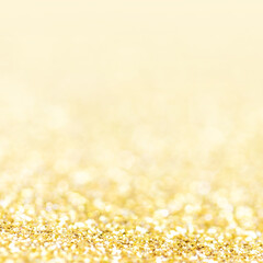 Golden lights Abstract  Christmas background. Magic shining gold dust. Holiday New year Glitter Defocused Background.