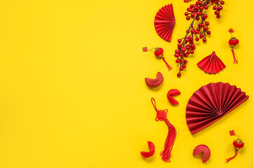 Composition with Chinese symbols and fortune cookies on yellow background. New Year celebration - Powered by Adobe