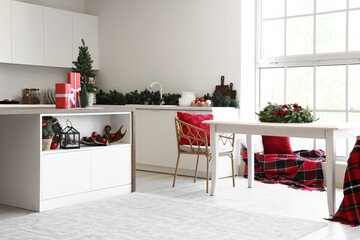 Interior of light kitchen with Christmas decor