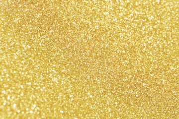 Golden yellow light glitter bokeh texture background. New Year, Christmas and all celebration background concepts.