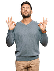 Handsome hispanic man wearing casual clothes relax and smiling with eyes closed doing meditation...