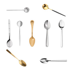 Stylish golden and silver spoons on white background