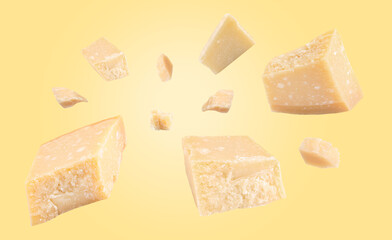 Parmesan cheese in air on pale yellow background, banner design