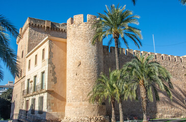 Fototapeta na wymiar The Altamira Palace, also known as Alcazar de la Senoria, located in the center of the Spanish city of Elche, on the banks of the Vinalopo River ans surrounded with palm trees
