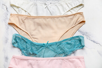 Set of stylish female panties on light background, closeup