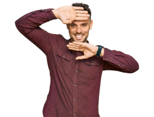 Young hispanic man wearing casual clothes smiling cheerful playing peek a boo with hands showing face. surprised and exited