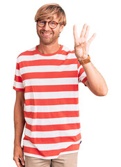 Handsome caucasian man with beard wearing casual clothes and glasses showing and pointing up with fingers number four while smiling confident and happy.