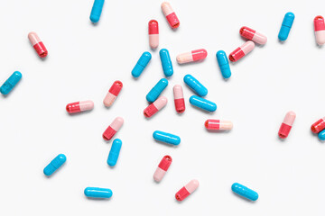 Many different pills on white background