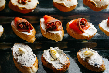 A Mouthwatering Medley of Delicious crostini and bruschettas on a glass display