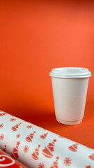 Cup Mockup Christmas. White mug on red background.