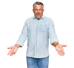 Middle age grey-haired man wearing casual clothes smiling cheerful with open arms as friendly welcome, positive and confident greetings