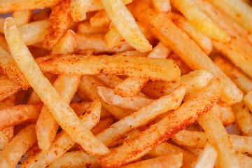 French fries potato sticks, in bulk, close-up, selective focus