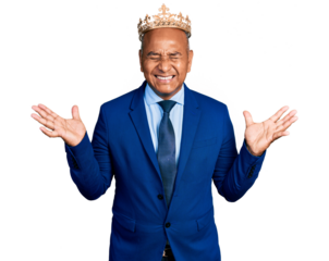 Hispanic middle age man wearing king crown celebrating mad and crazy for success with arms raised and closed eyes screaming excited. winner concept