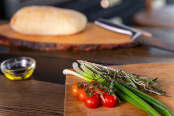 Fresh bread and ingredients for cooking snacks on table.