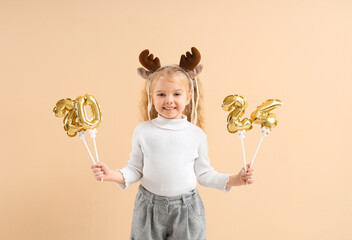 Cute little girl in reindeer horns with figure 2024 on beige background