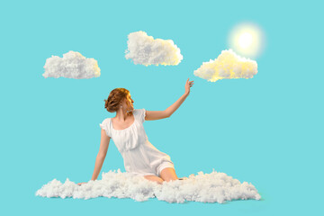 Young woman with white clouds on blue background