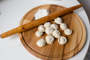 cooking ravoli on a wooden board