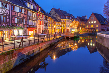 Traditional half-timbered houses in old town of Colmar at Christmas time, Alsace, France - obrazy, fototapety, plakaty