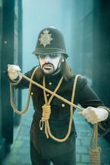 Male cosplay portrait of scary ghost British policeman in old London town