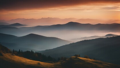 Obraz premium sunrise view over the foggy mountains 